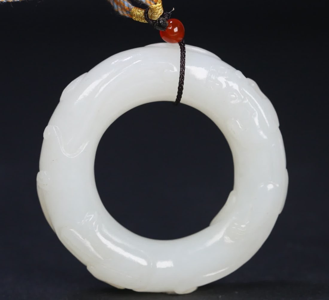A Qing Dynasty Hetian jade dragon pattern ring: Qing Dynasty Hetian jade dragon pattern ring SIZE: 5.3x1.3cm W:43.7g (The Dimensions Of All Batches Are Manually Measured.If You Need More Detailed Information, Please Contact Our Customer Service Bef