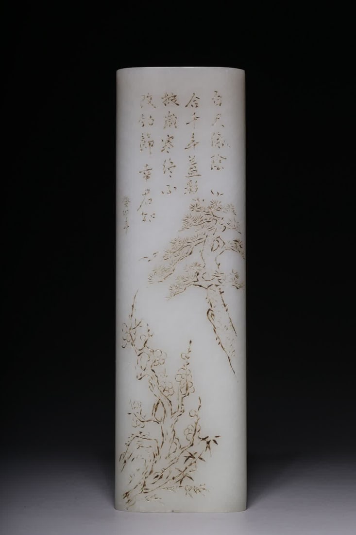 A Qing Dynasty Hetian white jade pine bamboo plum pattern armrest: Qing Dynasty Hetian white jade pine bamboo plum pattern arm rest This arm rest is regular in shape, the material is selected from Hetian white jade, the jade is delicate and warm, the structure is tig