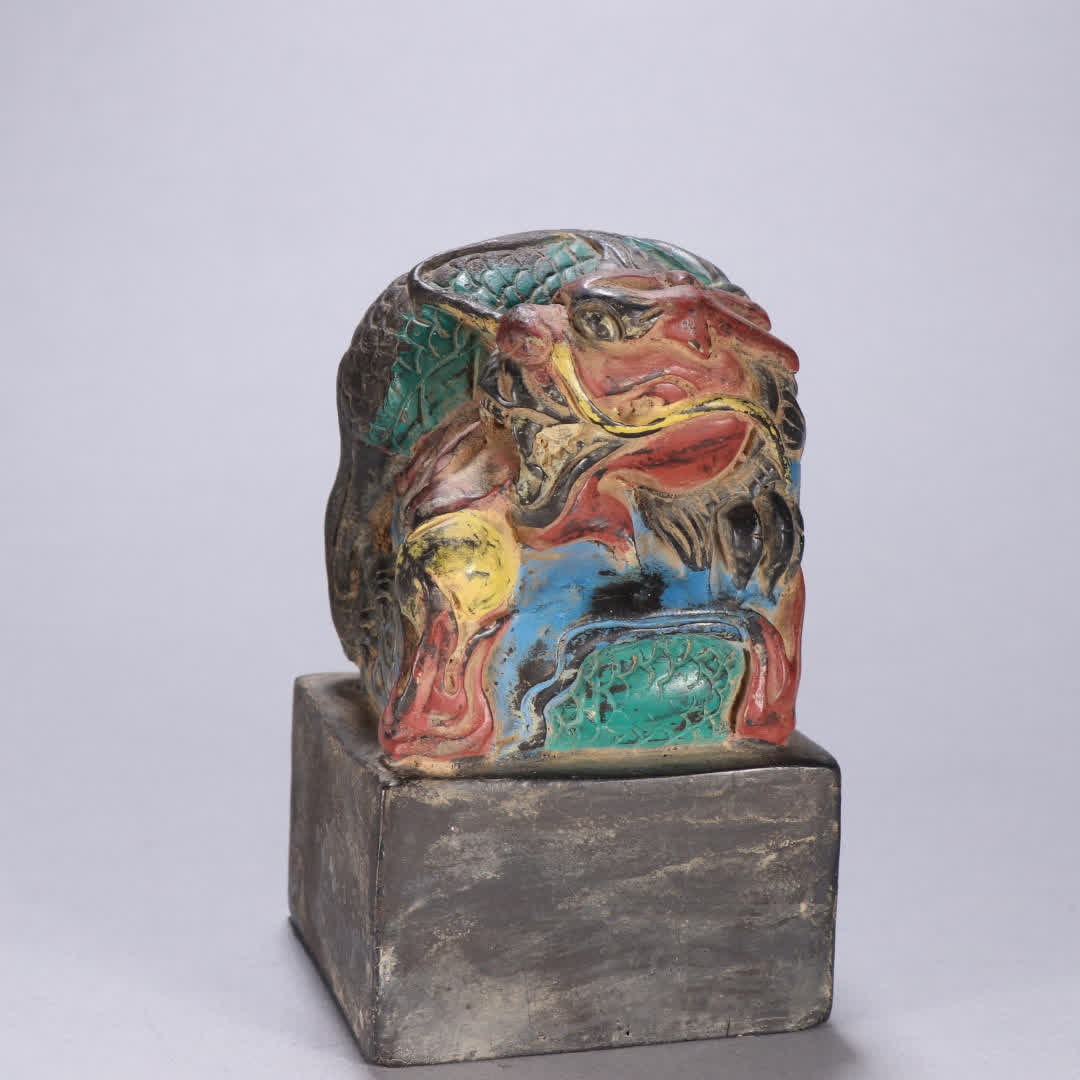 A Qing Dynasty copper and colorful dragon button seal (1 of 9)