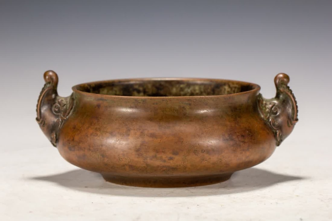 A Qing Dynasty copper beast ear furnace (1 of 9)