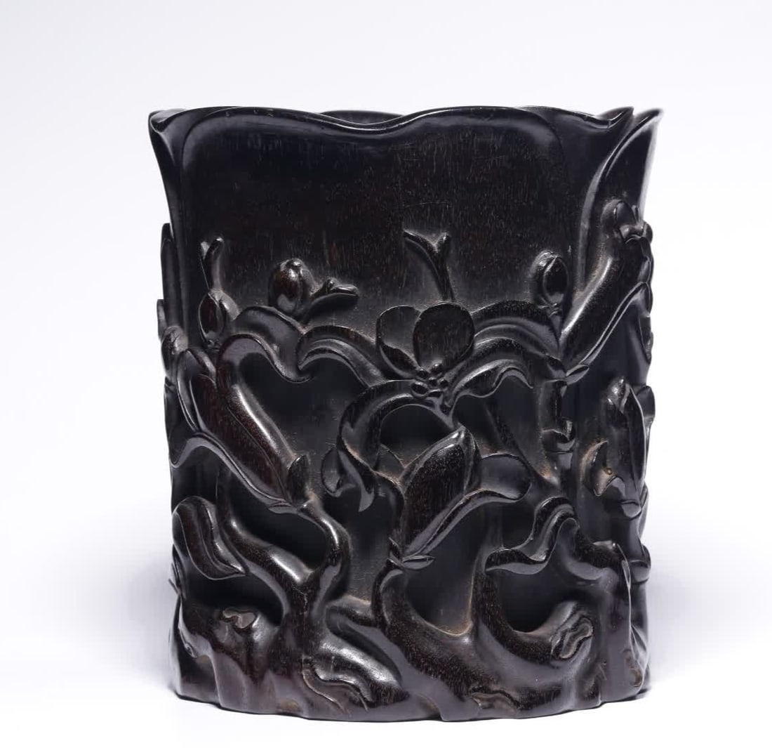A Qing Dynasty small-leaved rosewood gardenia pattern pen holder (1 of 9)