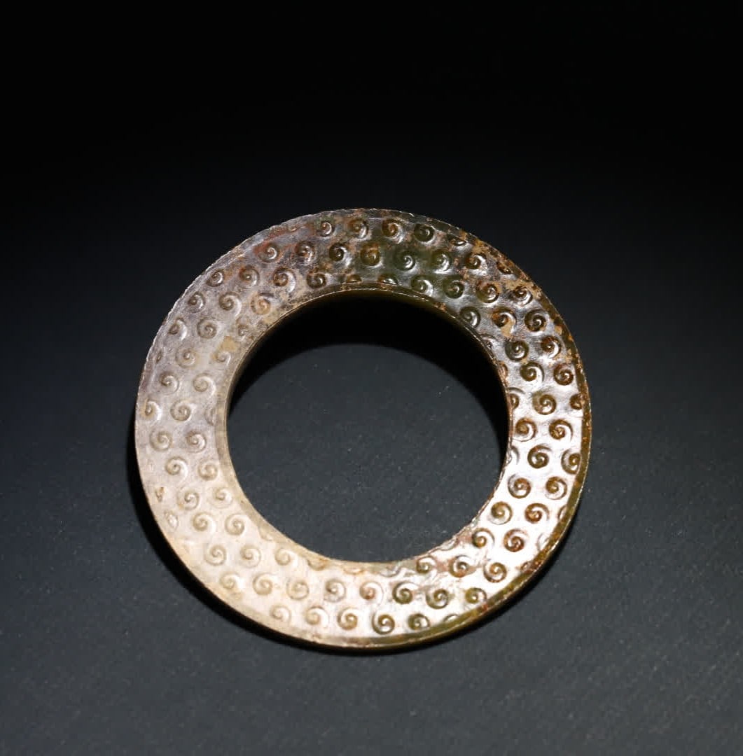 A Han Dynasty jade ring: Han Dynasty jade ring SIZE: 7.25x0.45cm W:23.8g (The Dimensions Of All Batches Are Manually Measured.If You Need More Detailed Information, Please Contact Our Customer Service Before Bidding.)