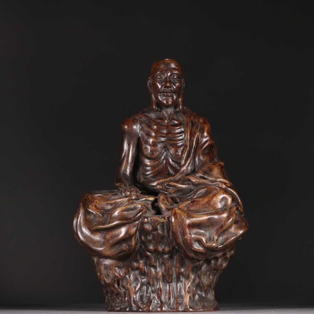 A statue of a skinny Arhat in the Qing Dynasty: Qing Dynasty agarwood skinny Arhat statue SIZE: H:24cm W:16cm W:500g (The Dimensions Of All Batches Are Manually Measured.If You Need More Detailed Information, Please Contact Our Customer Service Bef
