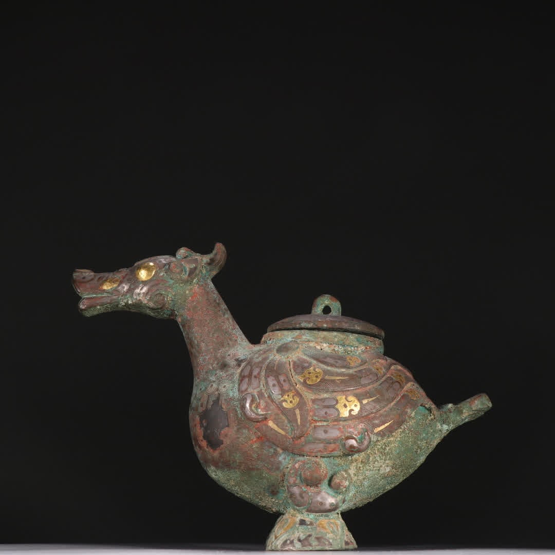 A Han Dynasty bronze vessel with gold and silver bird statues (1 of 9)