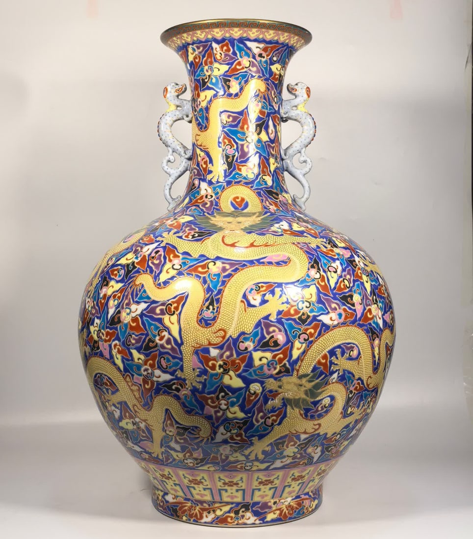 A Qing Dynasty Qianlong enamel cloisonne gold-painted Kowloon double dragon ear bottle: Qing Dynasty Qianlong enamel cloisonne gilded Kowloon double dragon ear bottle SIZE: H:56cm MouthD:18cm Belly diameter 38cm Foot diameter 20cm (The Dimensions Of All Batches Are Manually Measured.If Y