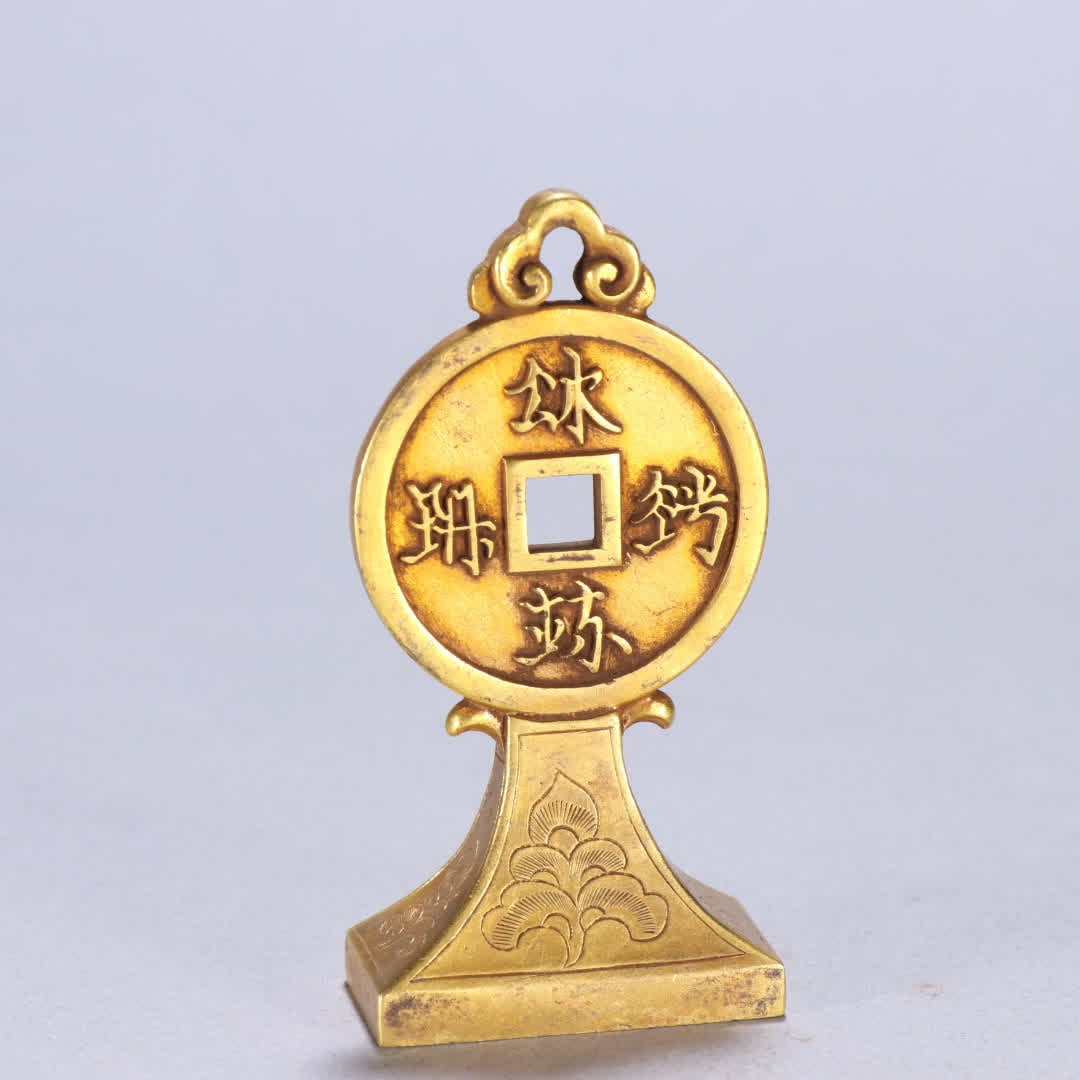 A Qing Dynasty copper-gilt coin button seal (1 of 9)