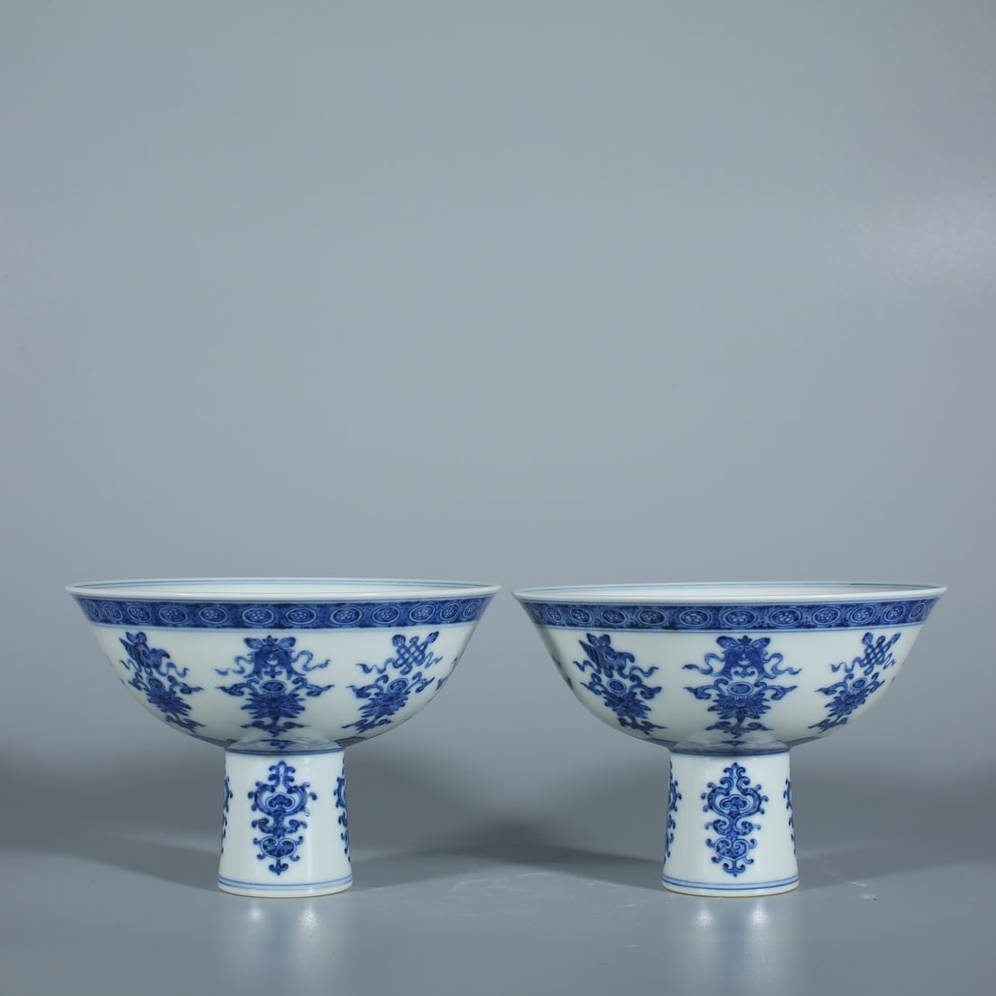An Exquisite Blue and White Eight Treasures Pattern Stem Bowl: An Exquisite Blue and White Eight Treasures Pattern Stem Bowl Qing Dynasty, China Yongzheng Six-character Mark Size:11cmx15.8cm (The Dimensions Of All Batches Are Manually Measured.If You Need More De