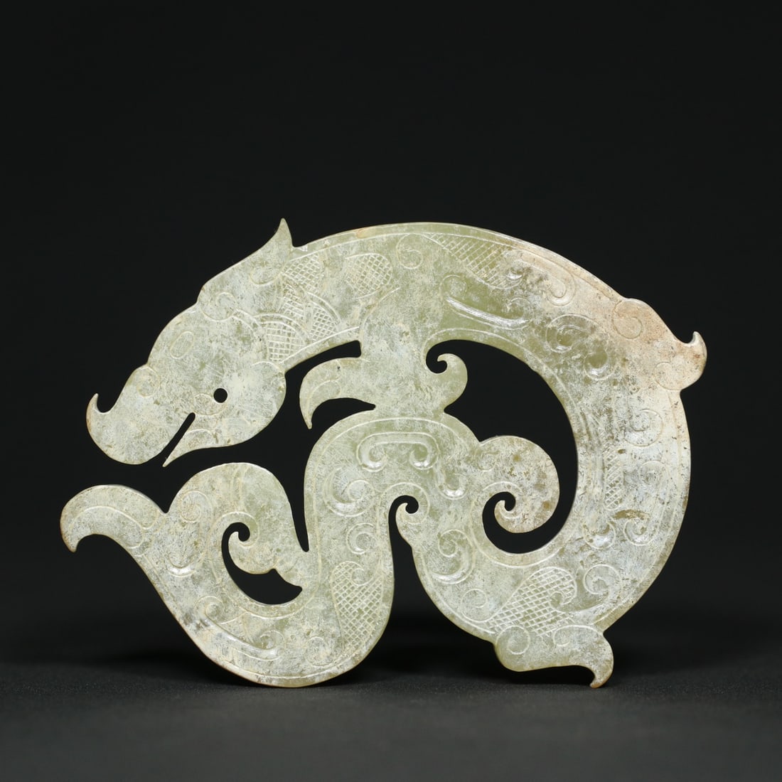 An Exquisite White Jade Dragon-Shaped Pendant: An Exquisite White Jade Dragon-Shaped Pendant the Spring and Autumn in Period in China Size:8.3cmx6cmx0.6cm Weight:56.3g (The Dimensions Of All Batches Are Manually Measured.If You Need More Detailed 