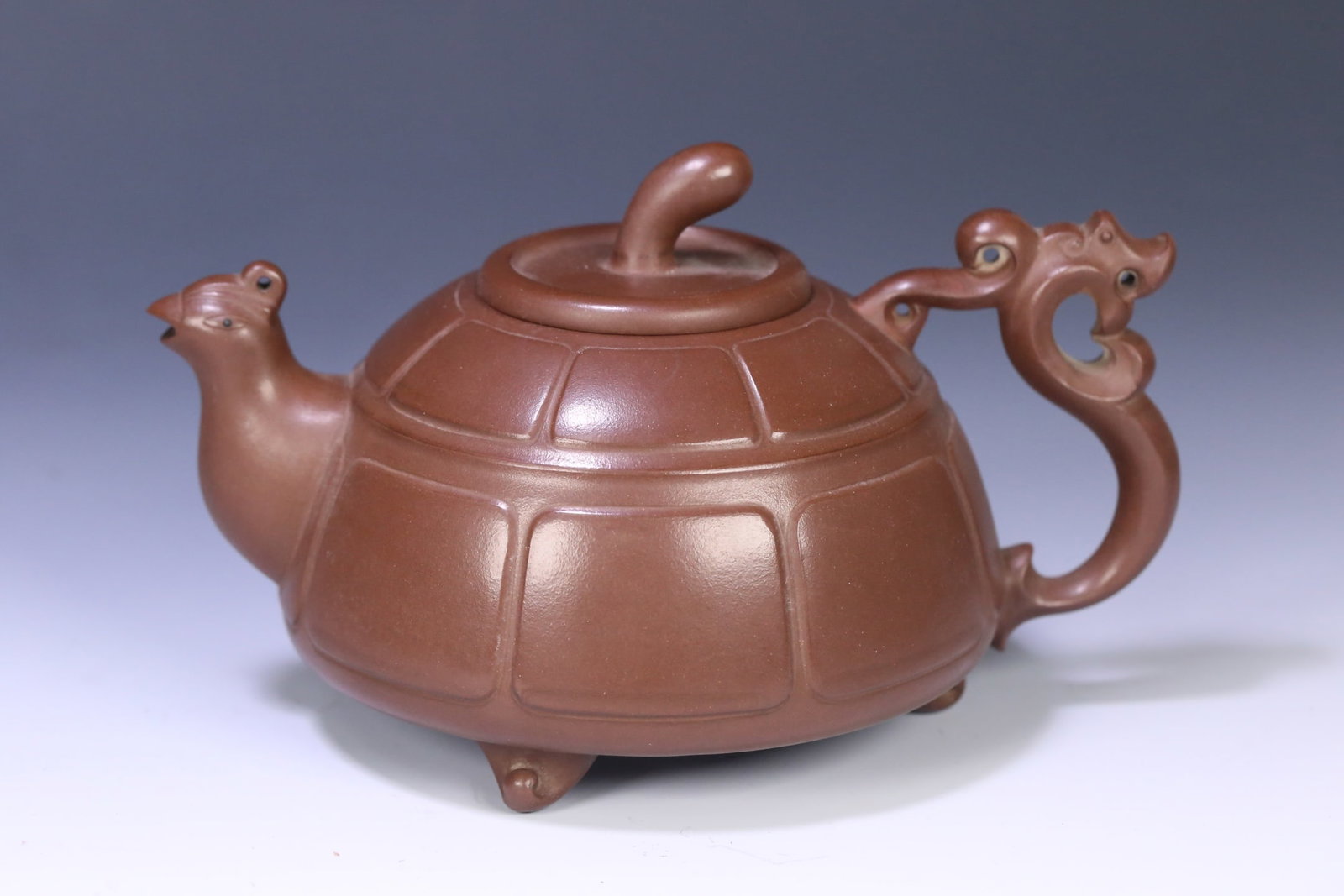 An Exquisite Purple Sands Teapot: An Exquisite Purple Sands Teapot Qing Dynasty, China Size:18cmx11cmx12.5cm (The Dimensions Of All Batches Are Manually Measured.If You Need More Detailed Information, Please Contact Our Customer