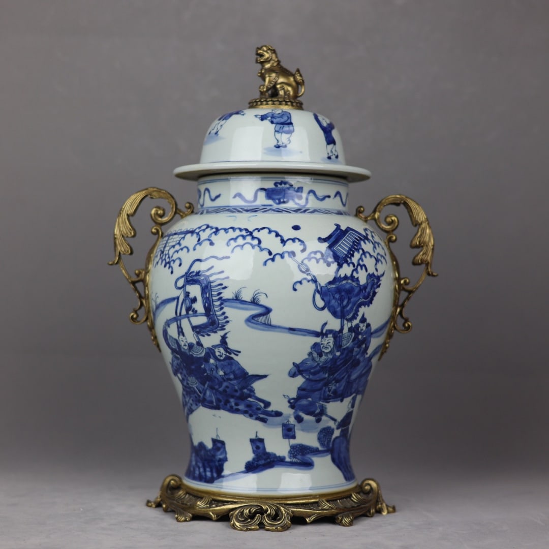 An Exquisite Blue and White Inlaid Bronze Character and Story Pattern Double-Ears Jar: An Exquisite Blue and White Inlaid Bronze Character and Story Pattern Double-Ears Jar Qing Dynasty, China Kangxi Six-character Mark Size:42cmx27cm (The Dimensions Of All Batches Are Manually