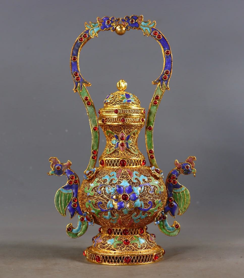 An Exquisite Gilt Bronze Inlaid Gems Lotus Pattern Double-Ears Vase: An Exquisite Gilt Bronze Inlaid Gems Lotus Pattern Double-Ears Vase Qing Dynasty, China Qianlong Four-character Mark Size:26cmx15cmx9.5cm Weight:512g (The Dimensions Of All Batches Are Manually Measur