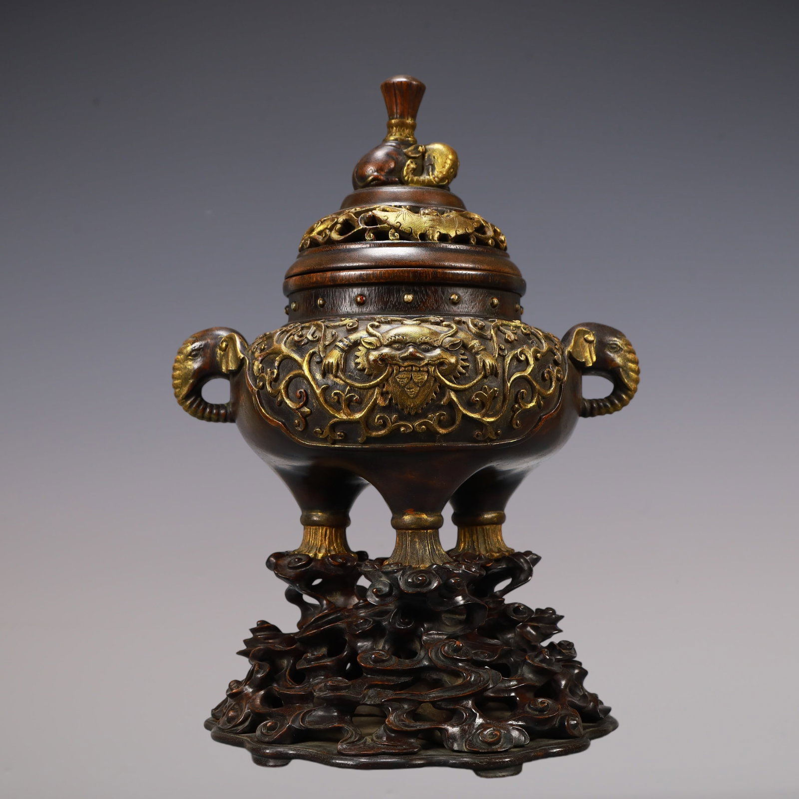 A Exquisite Eaglewood Gilt Beast-Face Pattern Double-Ears Tripod Censer: A Exquisite Eaglewood Gilt Beast-Face Pattern Double-Ears Tripod Censer Qing Dynasty, China Size:29.5cmx23cmx40cm Weight:1700g (The Dimensions Of All Batches Are Manually Measured.If You Need More Det