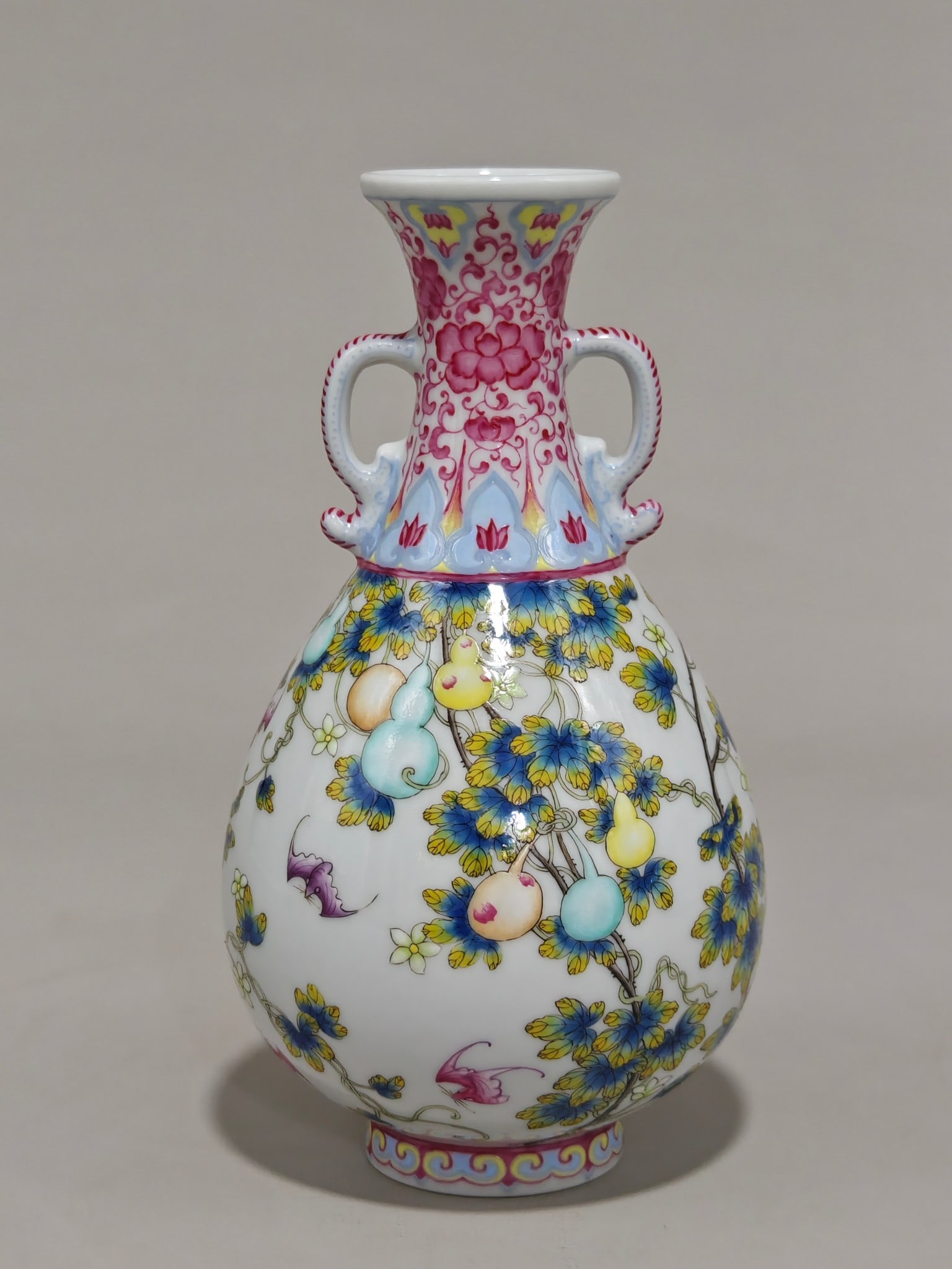 An Exquisite Enamel Lotus Pattern Double-Ears Vase: An Exquisite Enamel Lotus Pattern Double-Ears Vase Qing Dynasty, China Qianlong Four-character Mark Size:17cmx11cm (The Dimensions Of All Batches Are Manually Measured.If You Need More Detailed
