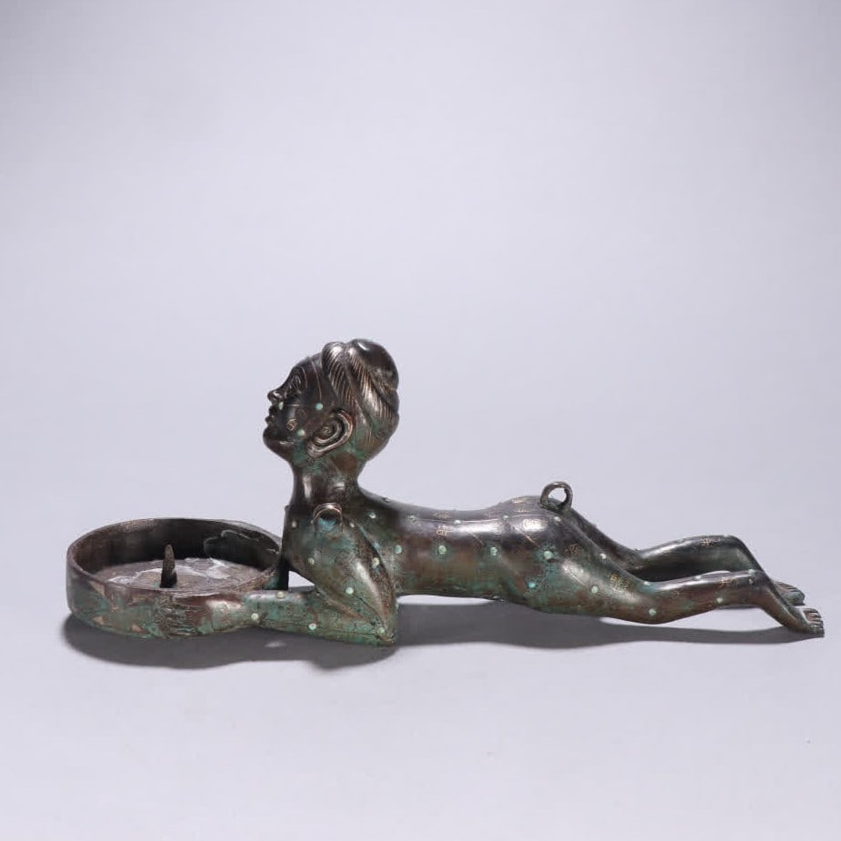A Han Dynasty copper gold and silver figure candlestick: Han Dynasty copper candlestick SIZE: H:4.6cm W:20.5cm W:587.4g (The Dimensions Of All Batches Are Manually Measured.If You Need More Detailed Information, Please Contact Our Customer Service Before Bi
