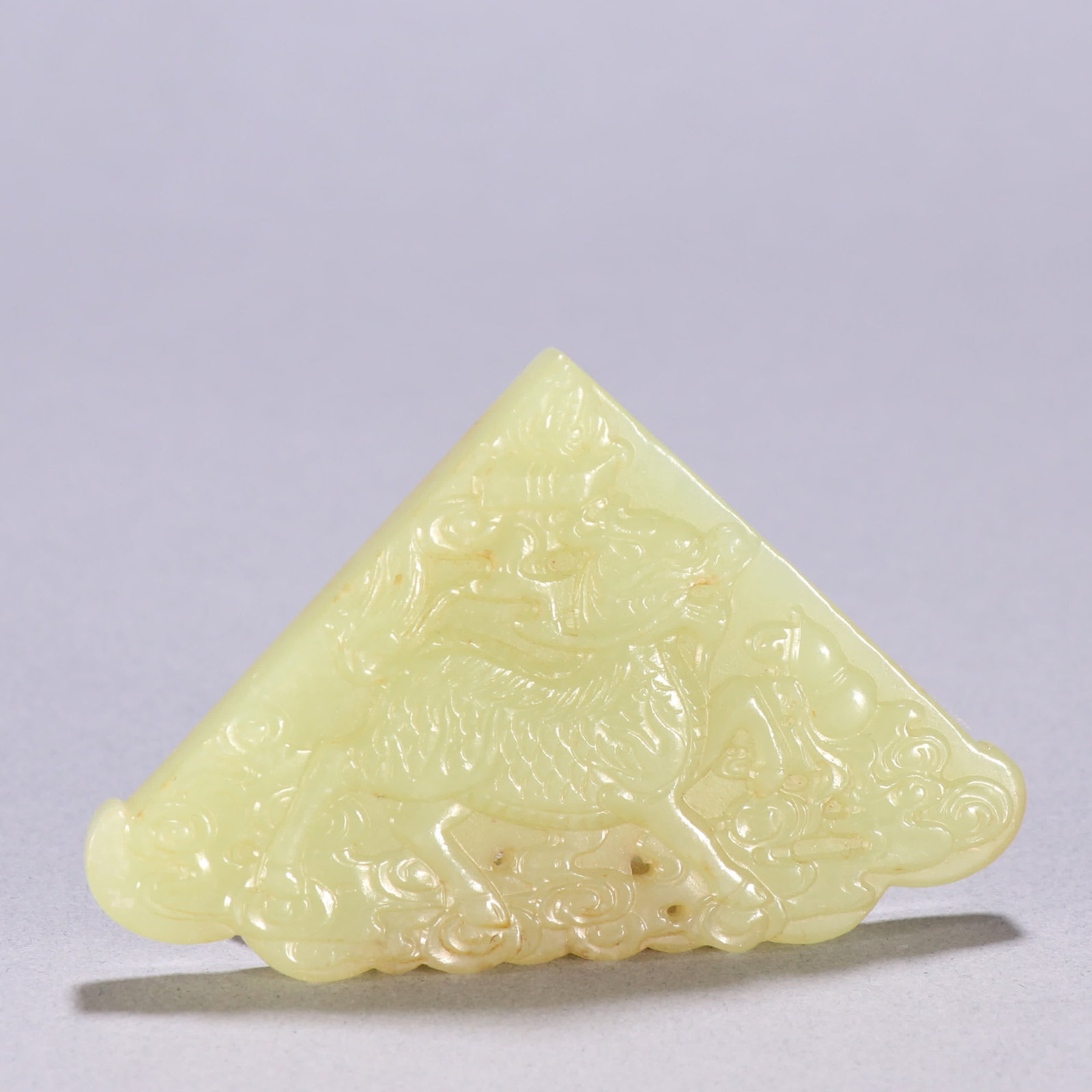 A Qing Dynasty Hetian topaz unicorn cloud pattern pendant: Qing Dynasty Hetian topaz unicorn cloud pattern pendant SIZE: W:4.9x7.7cm W:40g (The Dimensions Of All Batches Are Manually Measured.If You Need More Detailed Information, Please Contact Our Customer 
