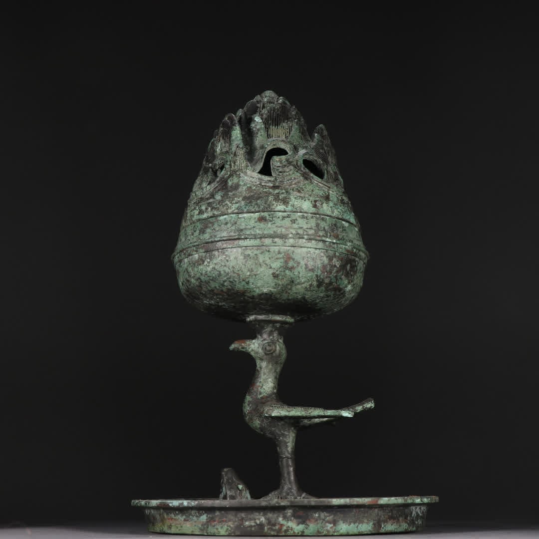 A Han Dynasty bronze phoenix bird stepping on the bowl aromatherapy stove (1 of 9)