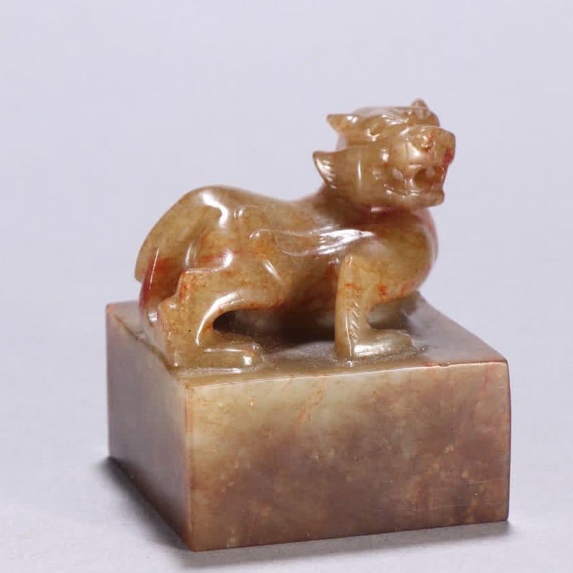A Han Dynasty Hetian jade beast button seal (1 of 9)