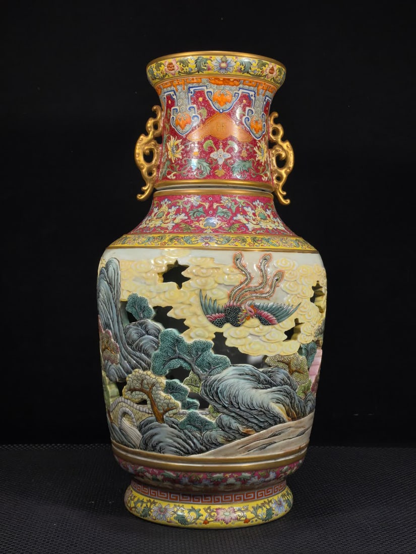A Qing Dynasty Qianlong enamel carmine red climbing flower hollow carved with a phoenix carousel: Qing Dynasty Qianlong enamel color carmine red climbing flower hollow carving with Fenglaiyi turning heart vase SIZE: H:50cm MouthD:16cm Belly diameter 27cm Foot diameter 18cm (The Dimensions Of All B