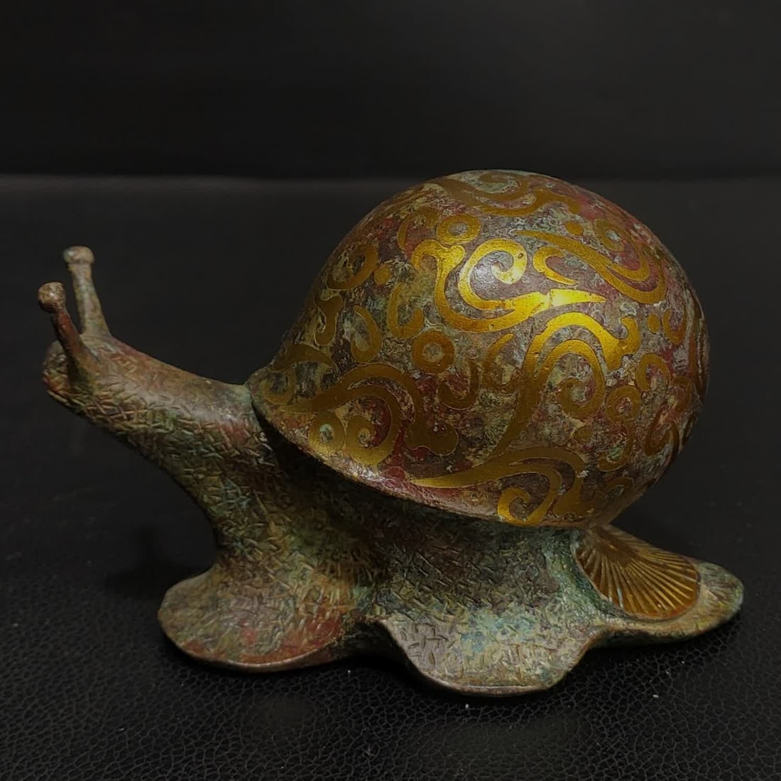 A gold copper snail ornament of Zhan Hancuo (1 of 9)