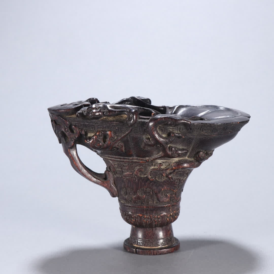 A Qing Dynasty agarwood dragon pattern cup: Qing Dynasty agarwood dragon pattern cup SIZE: H:9.3cm W:14cm W:82.7g (The Dimensions Of All Batches Are Manually Measured.If You Need More Detailed Information, Please Contact Our Customer Service Be