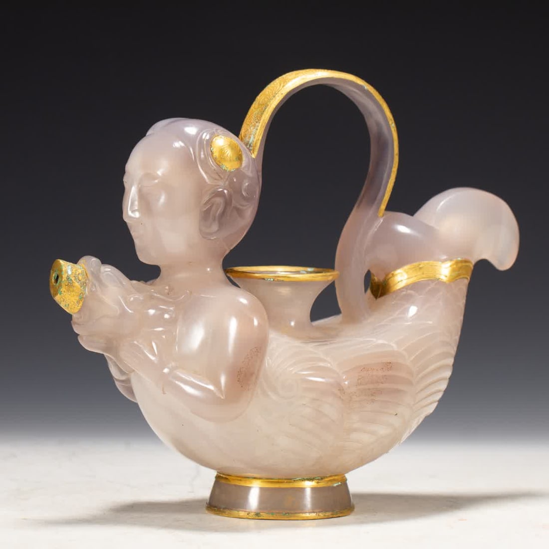 A Liao Dynasty agate gold-coated human head fish body pot (1 of 9)