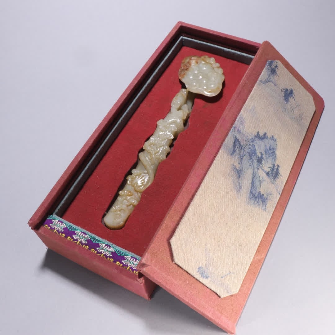 A Qing Dynasty Hetian jade Ganoderma lucidum pattern ruyi handle: Qing Dynasty Hetian jade Ganoderma lucidum pattern ruyi handle SIZE: L:25.2cm W:6.5cm W:271g (The Dimensions Of All Batches Are Manually Measured.If You Need More Detailed Information, Please Contact 