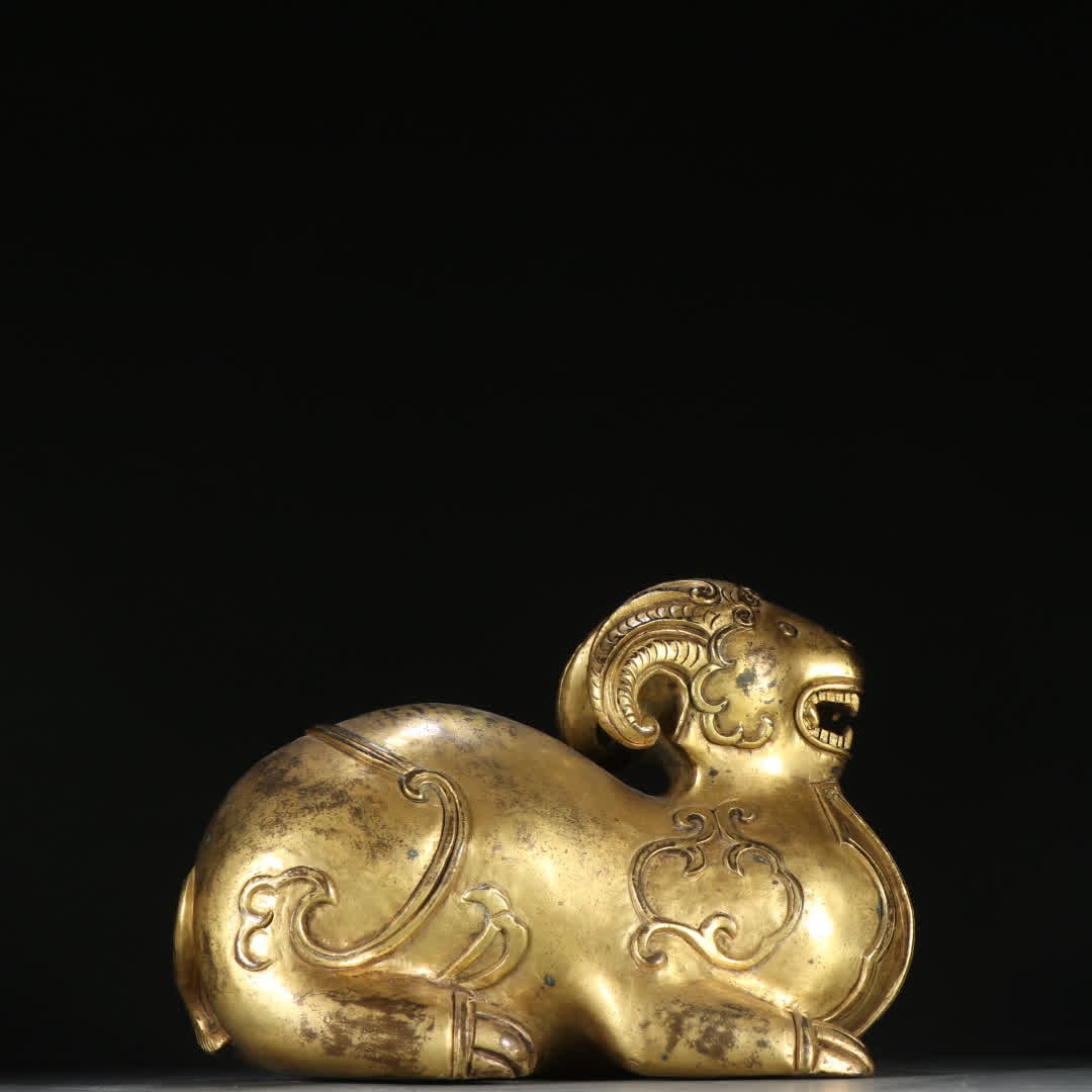 A Qing Dynasty copper gilt lying sheep ornament (1 of 9)