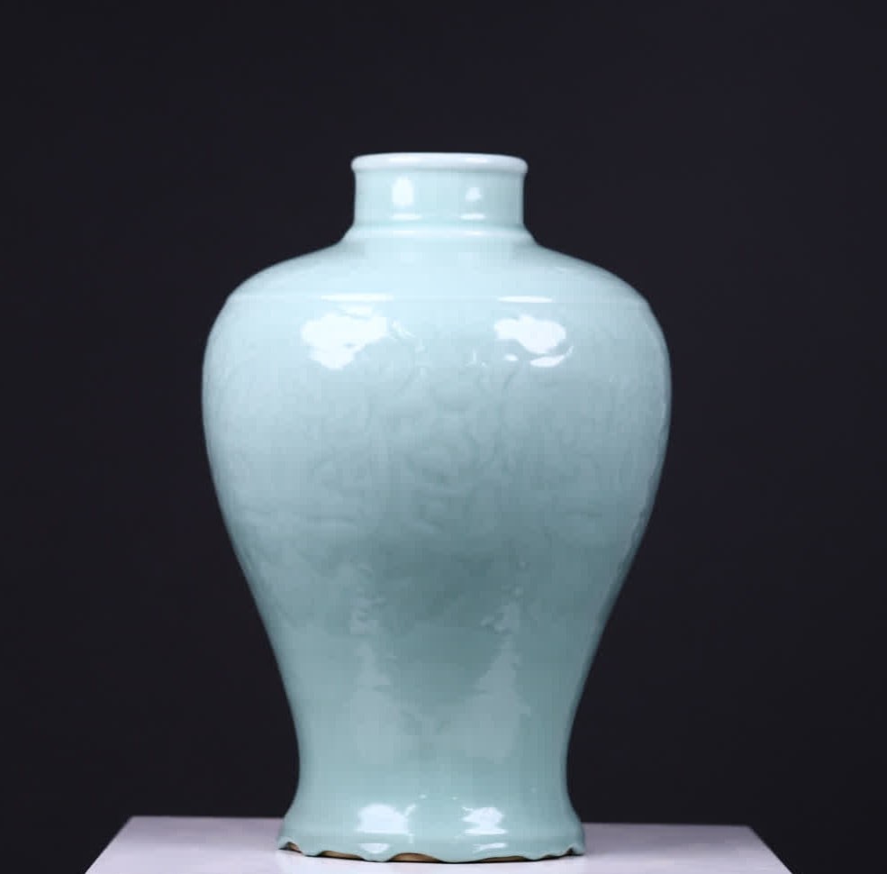 A Qing Dynasty bean celadon glazed engraved entwined flower pattern appreciation bottle (1 of 9)