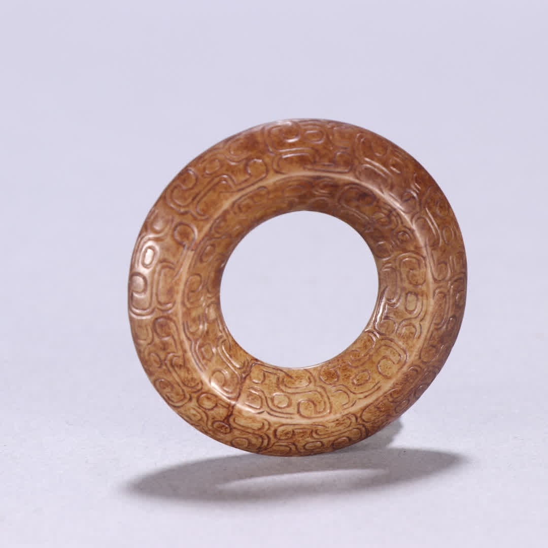 A Han Dynasty Hetian jade hook moire ring: Han Dynasty Hetian jade hooked up with cloud pattern rings SIZE: W:4.7cm W:25.6g (The Dimensions Of All Batches Are Manually Measured.If You Need More Detailed Information, Please Contact Our