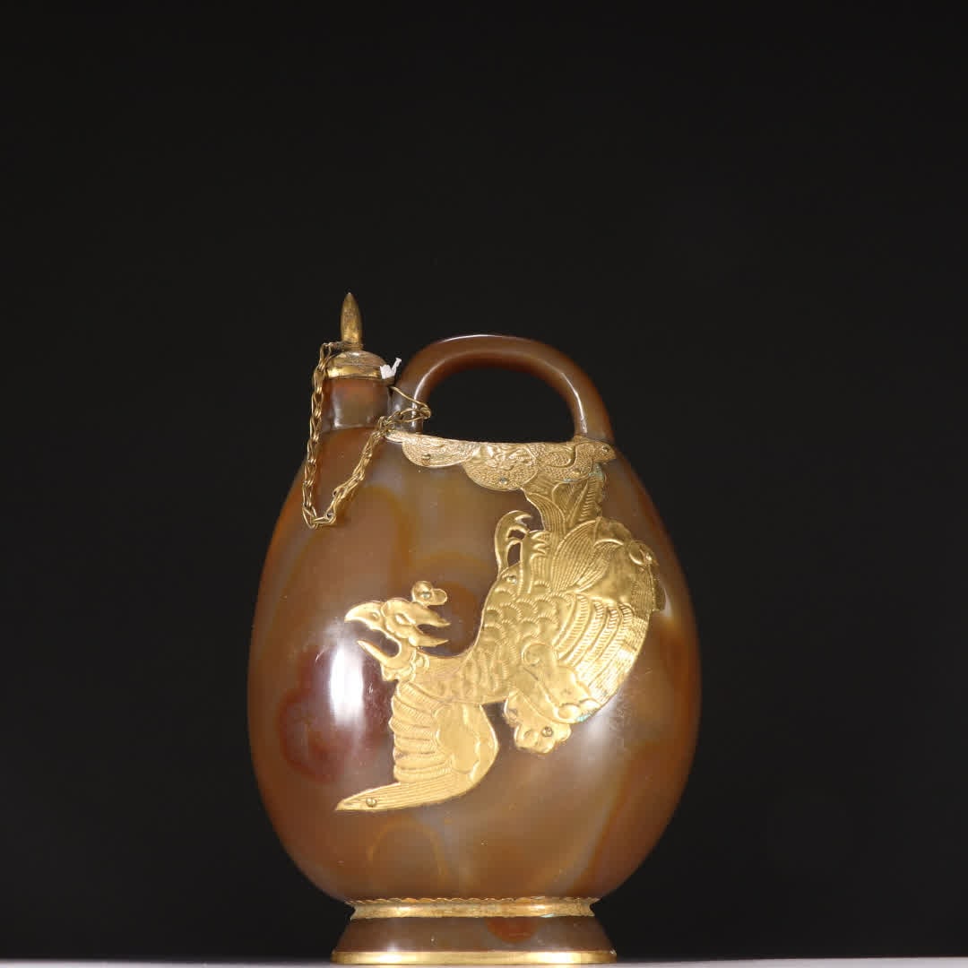 A Liao gold agate-wrapped golden phoenix pattern skin pot (1 of 9)