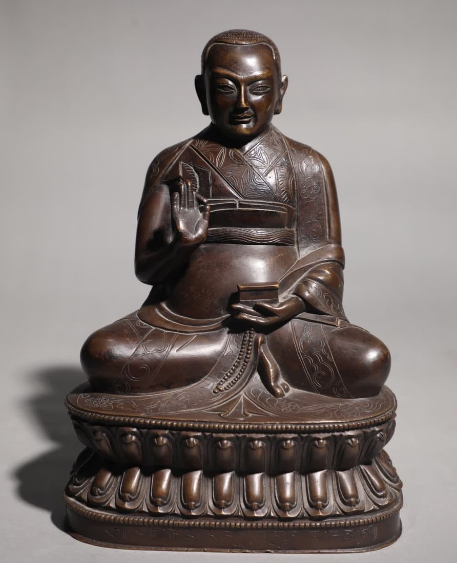 A seated statue of a bronze guru Buddha in the Qing Dynasty (1 of 9)