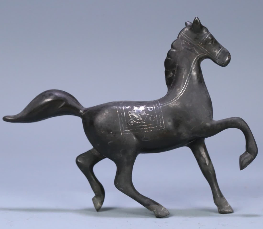 A Han Dynasty copper silver horse ornament (1 of 9)