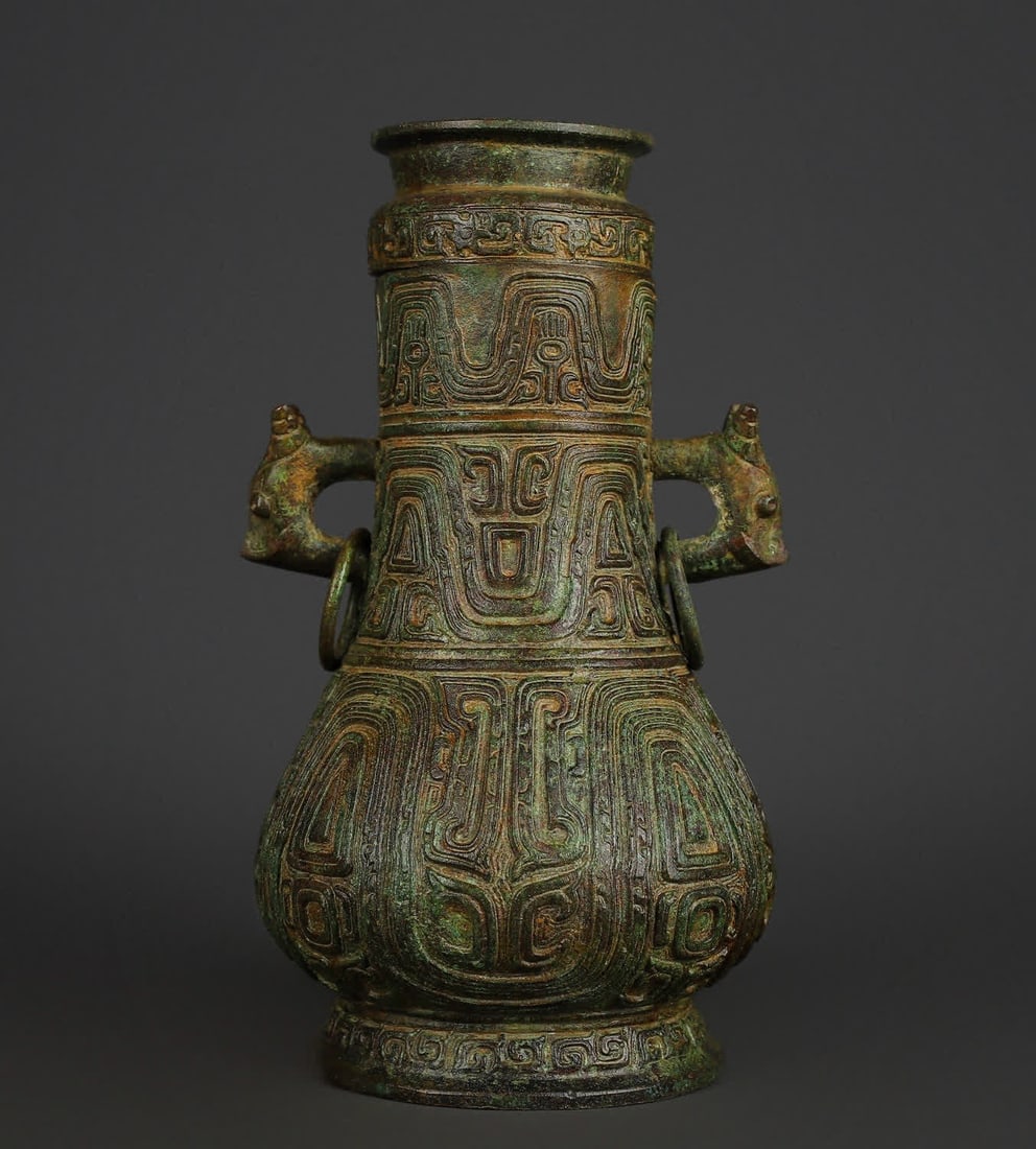 A Western Zhou bronze double dragon round vase (1 of 9)