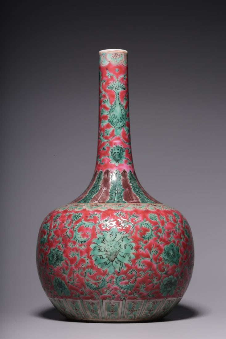 A Qing Dynasty carmine background green color entwined floral pattern long neck bottle (1 of 7)