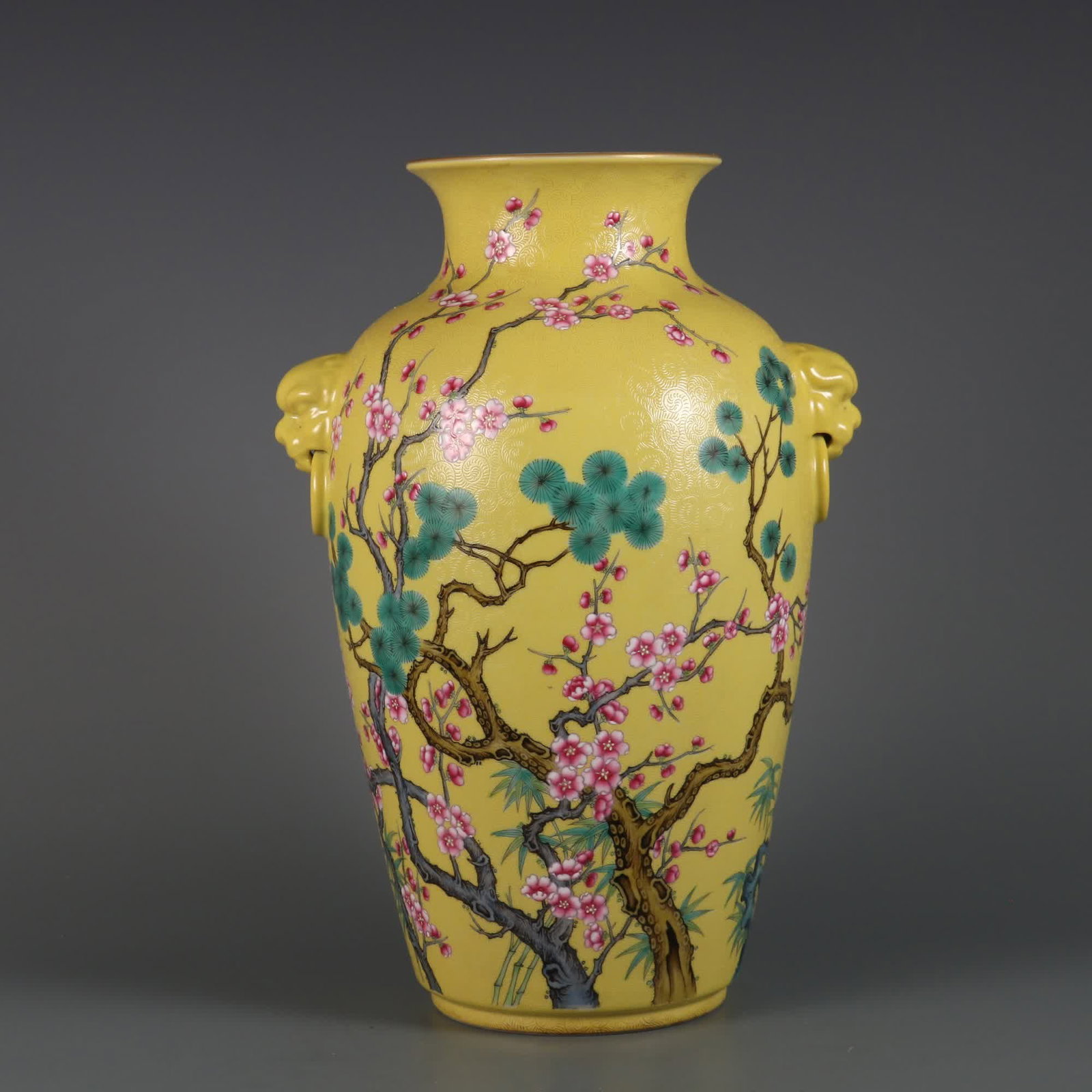 A Qing Dynasty Yongzheng imperial yellow ground pick-up flower enamel color year cold three friends: Qing Dynasty Yongzheng imperial yellow ground pick-up flower enamel color year cold three friends beast ear bottle SIZE: H: 31.8cm Belly diameter 20cm MouthD: 11.5cm (The Dimensions Of All Batches Are