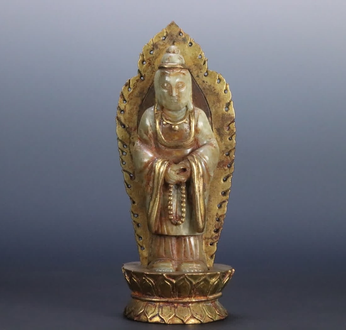 A statue of Liao gold and Tian jade-wrapped copper gilt Guanyin: Liao Jin Hetian jade-wrapped copper gilt Guanyin statue SIZE: 24.5x9.4x9.3cm W:1760g (The Dimensions Of All Batches Are Manually Measured.If You Need More Detailed Information, Please Contact Our