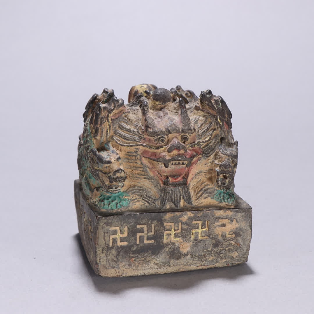 A Qing Dynasty copper with colorful dragon button swastika seal (1 of 9)
