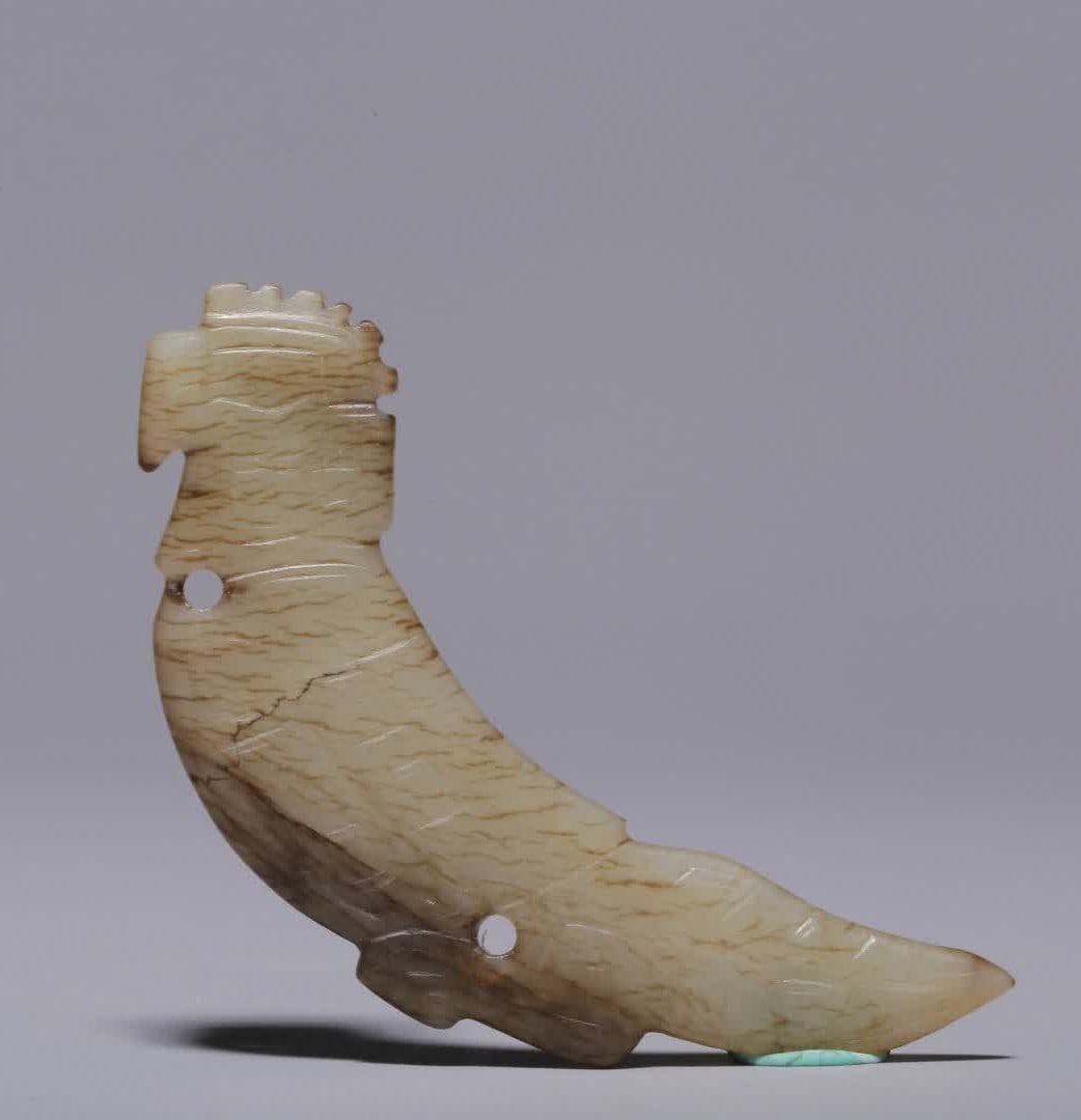 A jade pendant of Hetian jade god bird in the Shang and Zhou dynasties (1 of 7)