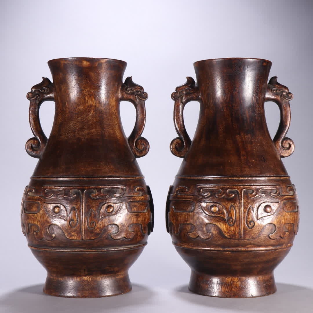 A pair of Qing Dynasty agarwood double dragon ear appreciation bottles: A pair of agarwood double dragon ear appreciation bottles in the Qing Dynasty SIZE: H: 28cm MouthD: 9.5cm Total W: 1954g (The Dimensions Of All Batches Are Manually Measured.If You Need More Detailed 