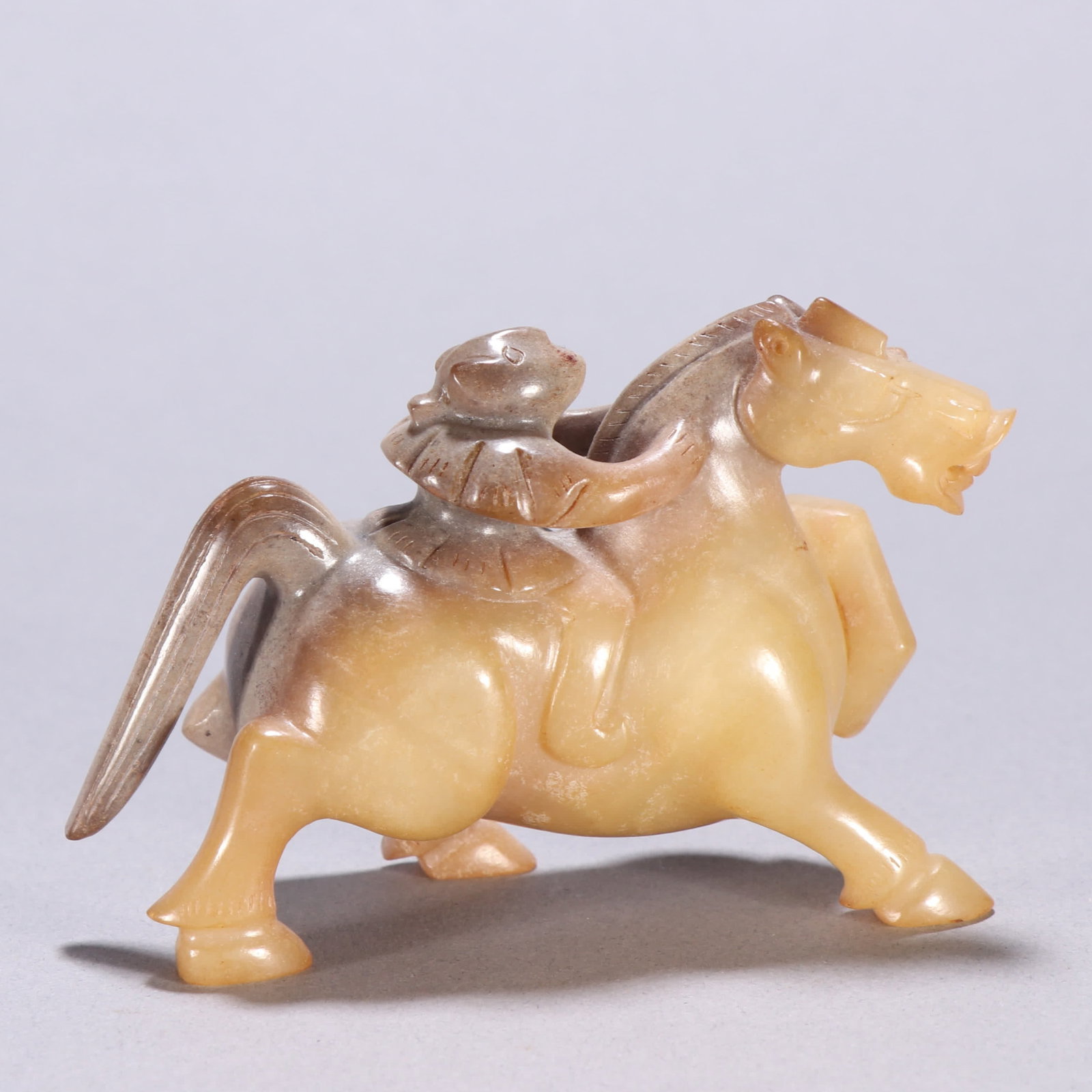 A Han Dynasty Hetian jade man riding a beast (1 of 9)