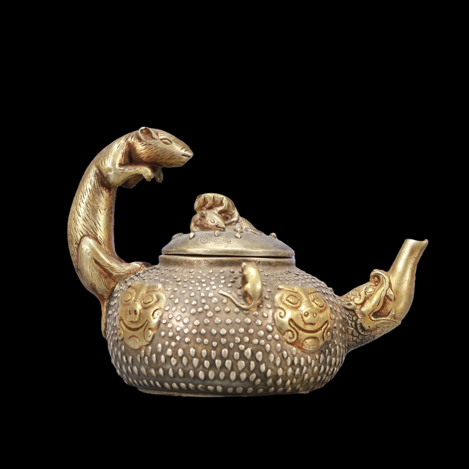 A Exquisite Gilt Silver Beast-Face Pattern Teapot: A Exquisite Gilt Silver Beast-Face Pattern Teapot Qing Dynasty, China Qianlong Four-character Mark Size:15.5cmx11cmx11cm Weight:600g (The Dimensions Of All Batches Are Manually Measured.If You Need