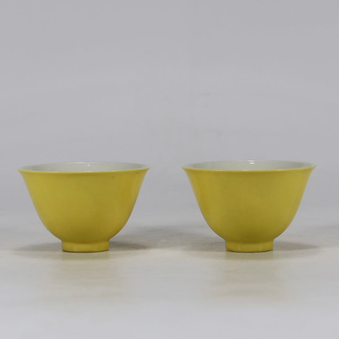 A Pair of Exquisite Yellow Glazed Cup: A Pair of Exquisite Yellow Glazed Cup Qing Dynasty, China Kangxi Six-character Mark Size:4.5cmx7cm (The Dimensions Of All Batches Are Manually Measured.If You Need More Detailed Information, Please Co