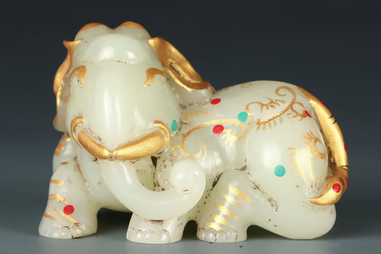 A finely crafted Qing Dynasty painted Hetian jade elephant handle (1 of 9)
