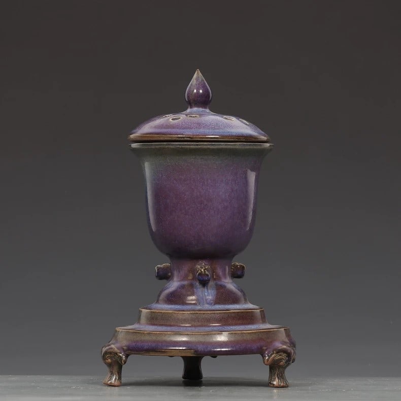 A fine Song Dynasty Jun kiln grape purple-glazed three-legged incense burner: Song Dynasty Jun kiln grape purple glaze three-legged incense burnerSIZE:H:23cm D:10.5cm D:14cm(The Dimensions Of All Batches Are Manually Measured.If You Need More Detailed Information, Please Contac