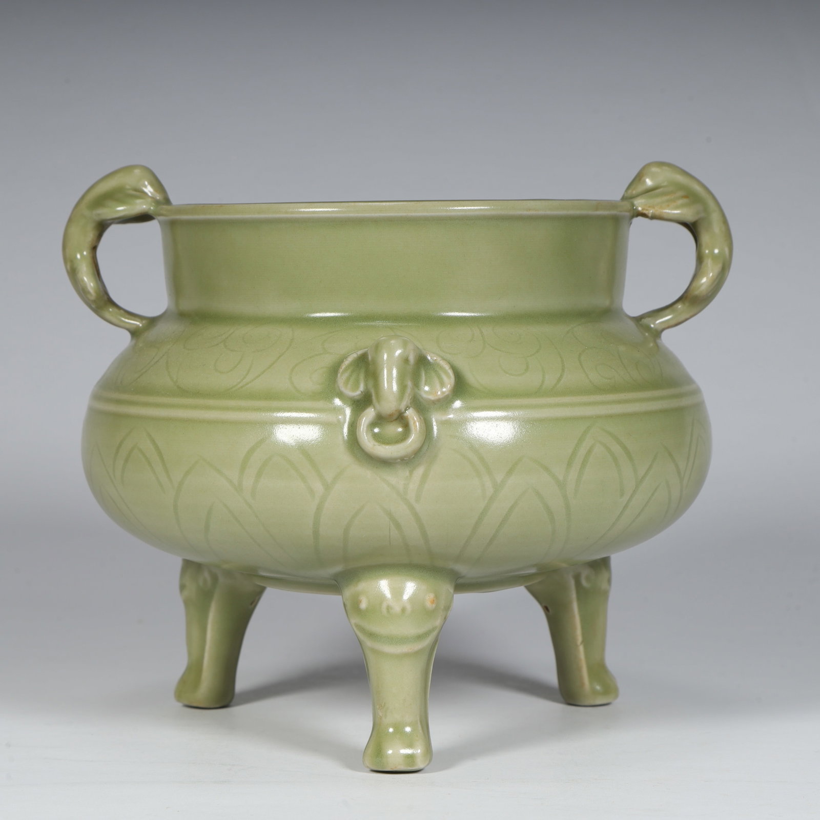 A fine Song Dynasty Yaozhou kiln celadon and engraved double-handled tripod burner (1 of 10)