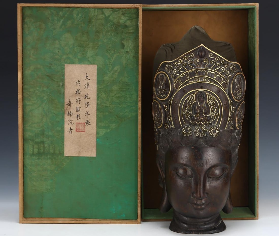 A beautiful Qing Dynasty agarwood Guanyin Buddha head painted with gold and colors: The head of the Agarwood Guanyin Buddha in the Qing Dynasty is painted with gold and colorful decorationsSIZE:H:39cm W:19cm(The Dimensions Of All Batches Are Manually Measured.If You Need More Detaile