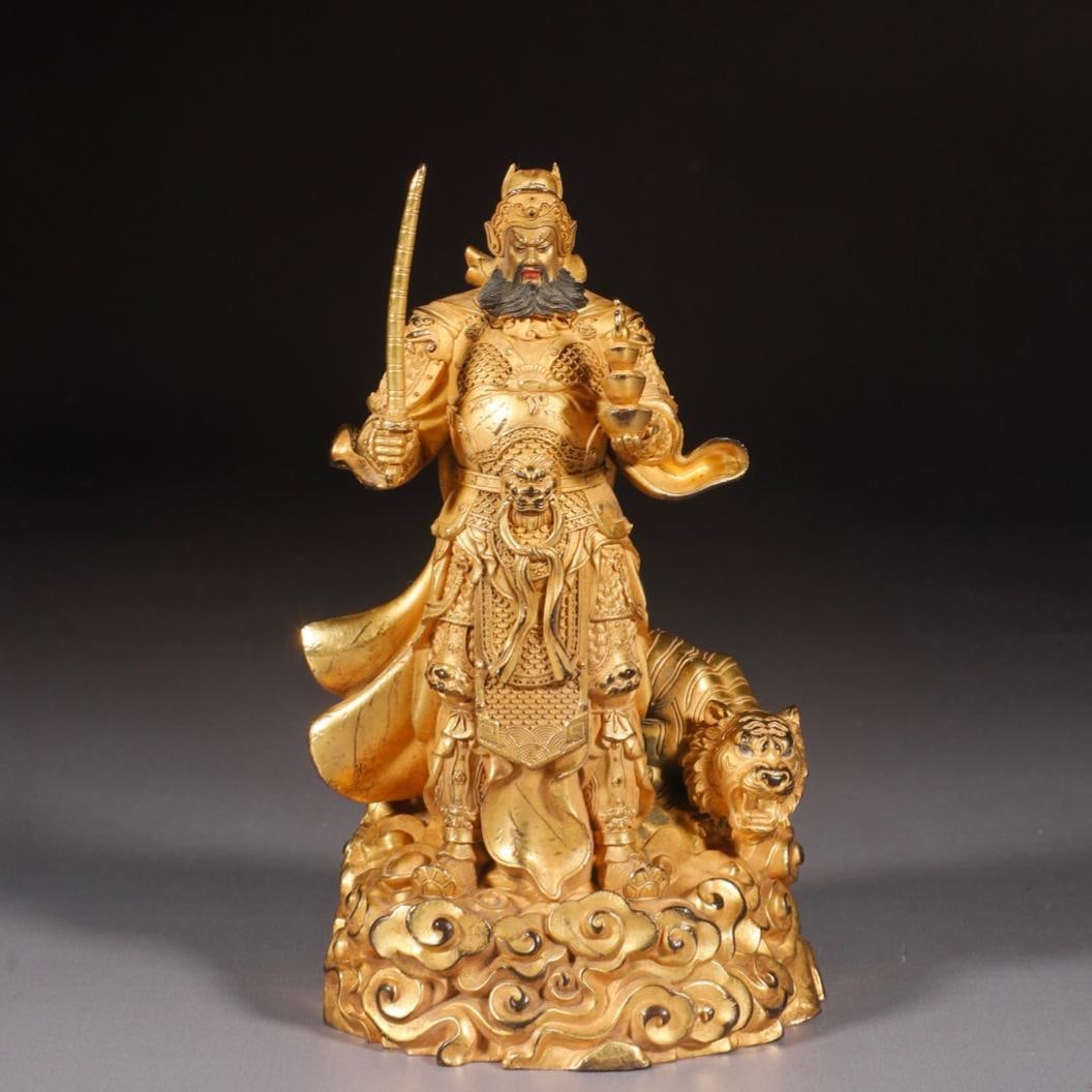 A fine Ming Dynasty gilded bronze statue of Zhao Gongming, the God of Wealth, riding a horse (1 of 9)