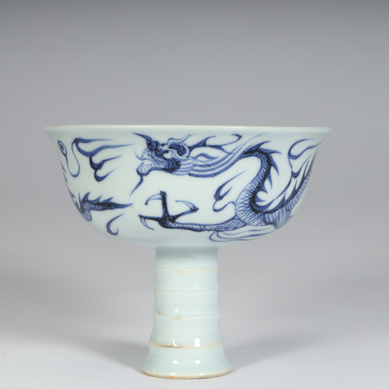 A fine Yuan Dynasty blue-and-white bamboo-joint tall bowl with cloud and dragon motifs (1 of 10)