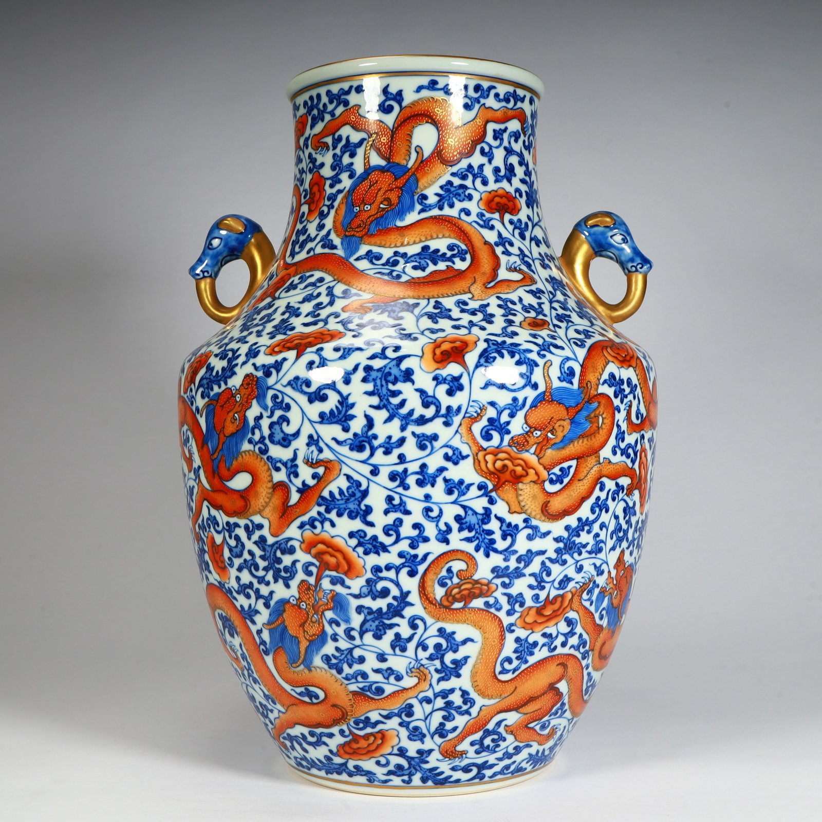 A fine Qing Dynasty Qianlong period blue-and-white alum red gold-painted nine-dragon double-handled: Qing Dynasty Qianlong period blue-and-white alum red gilded nine-dragon twin-handled lucky tube vase with entwined branch patternsSIZE:H: 38cm L: 24.5cm W: 24.5cm W: 4.9kg(The Dimensions Of All Batche