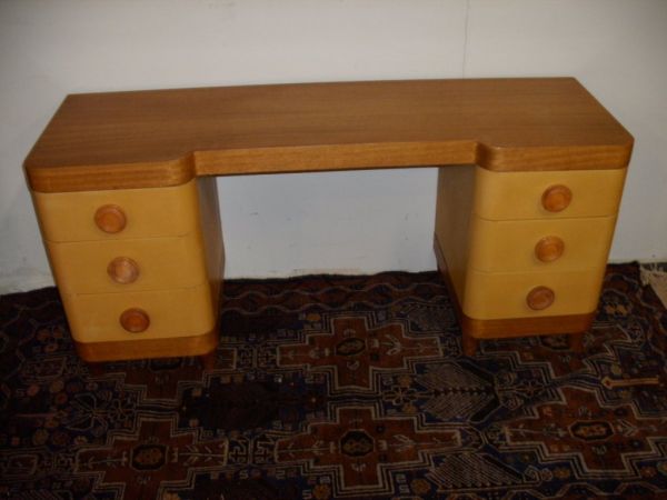 LEATHER COVERED VANITIY IN THE MANNER OF RHODE: NICE VANITIY IN THE STYLE OF GILBERT RHODE LONG AND LOW WITH LEATHER COVERED BASE WITH THREE DRAWERS ON EACH SIDE BIG WOOD PULLS MAHOGANY BASE AND TOP 42 1/2 X 52 X 17 UNMARKED